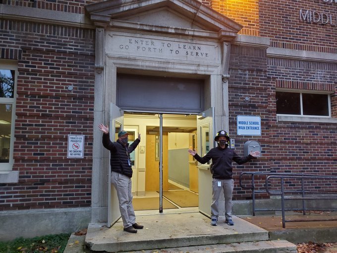 Holding doors open for school